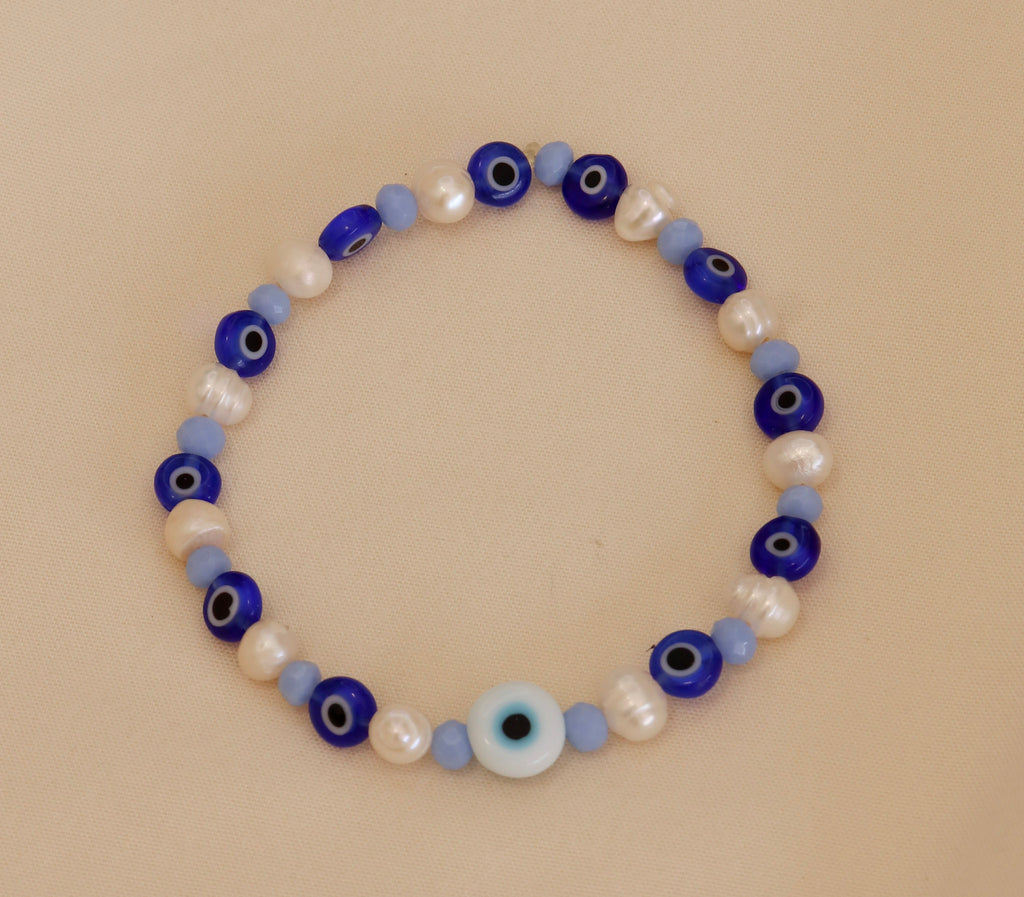 Pulsera Ojos azules con perlas blancas